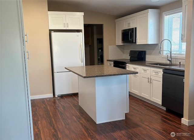 kitchen featuring dark hardwood / wood-style floors, a kitchen island, black appliances, decorative backsplash, and white cabinets