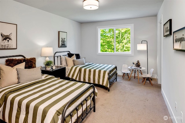 bedroom featuring light carpet