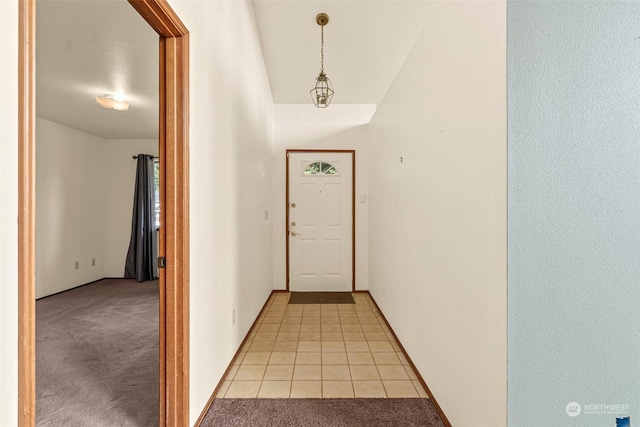 entryway with light tile patterned floors