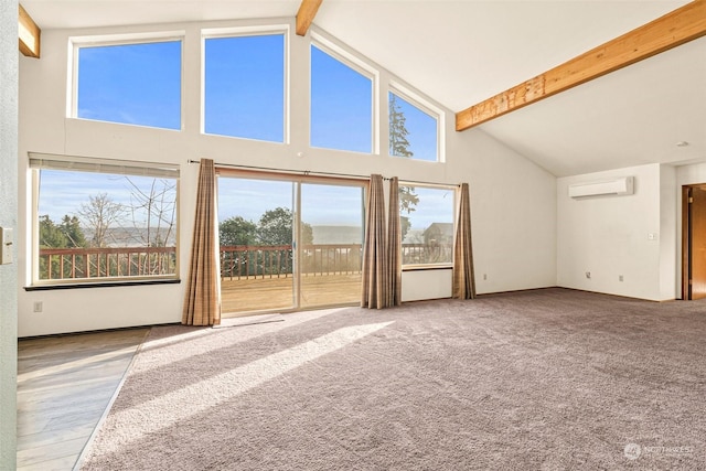 unfurnished living room with carpet flooring, a wealth of natural light, a wall mounted air conditioner, high vaulted ceiling, and beamed ceiling