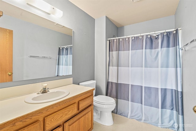 bathroom featuring toilet, vanity, and a shower with shower curtain