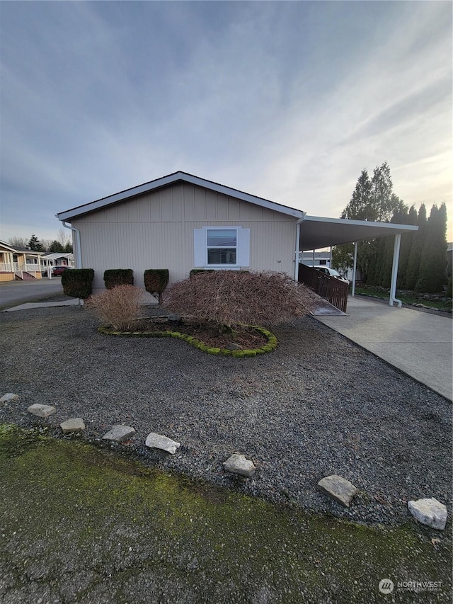 view of side of property featuring a carport