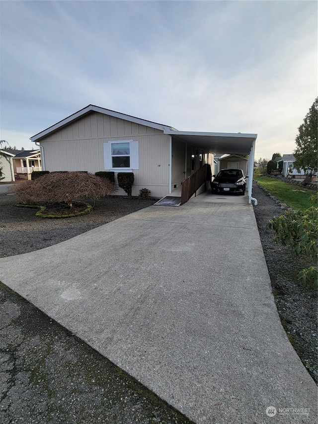 view of side of property with a carport