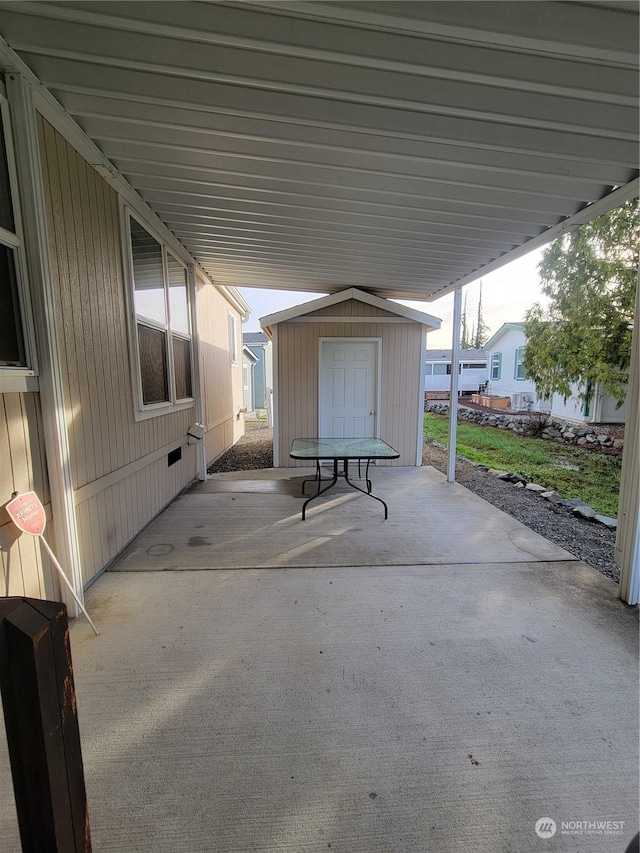 view of patio / terrace featuring a storage unit