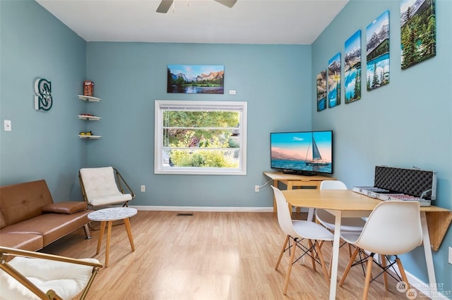 home office featuring light wood-type flooring and ceiling fan