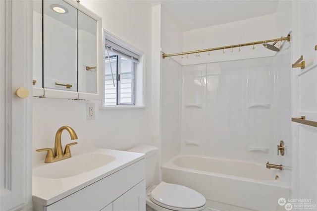 full bathroom featuring toilet, vanity, and shower / washtub combination