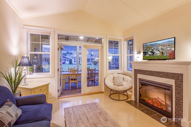 living room featuring lofted ceiling