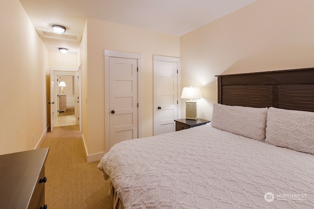 bedroom with light colored carpet