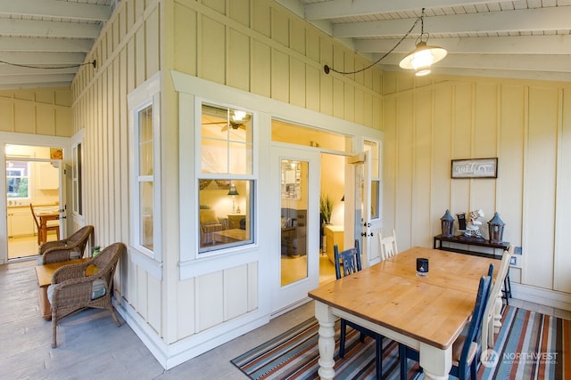 exterior space with wood ceiling and lofted ceiling with beams