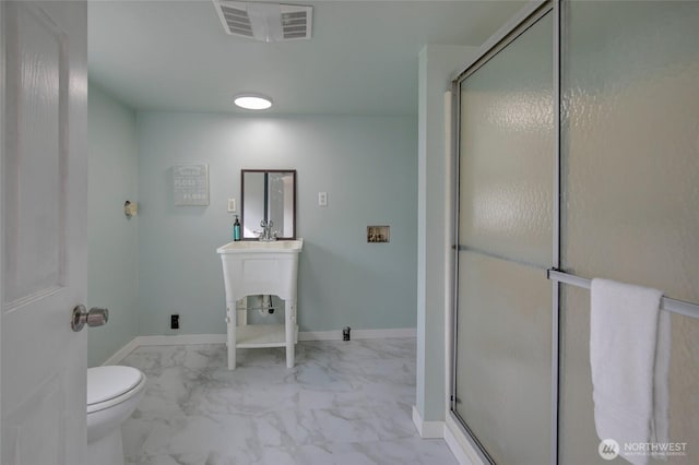 full bath with a shower stall, baseboards, visible vents, and marble finish floor