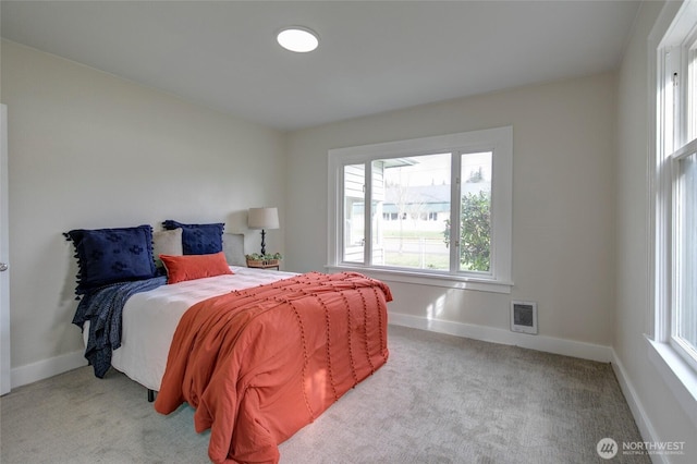 carpeted bedroom with baseboards