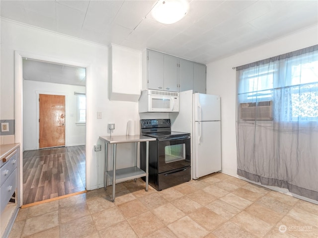 kitchen featuring plenty of natural light, white appliances, gray cabinetry, and cooling unit