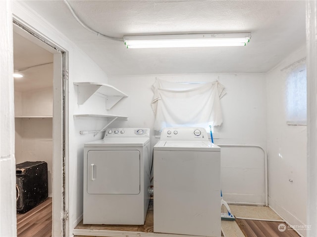 laundry room featuring washing machine and clothes dryer