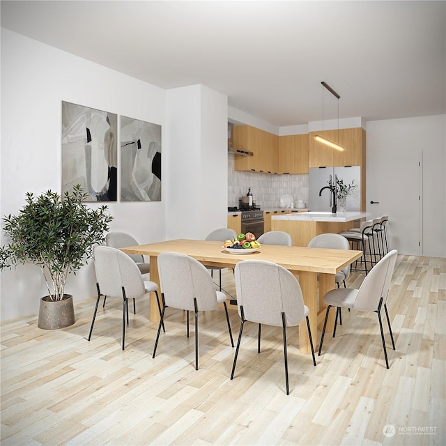 dining area with light wood-type flooring