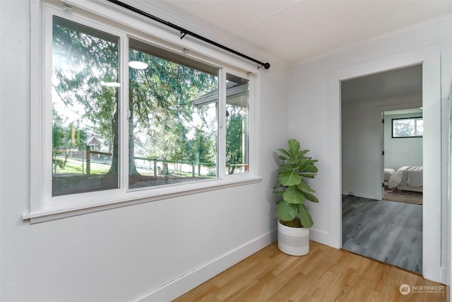 hallway with light hardwood / wood-style flooring