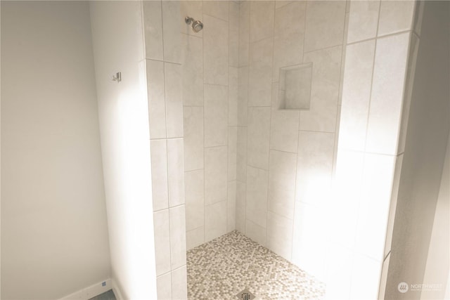 bathroom with tiled shower