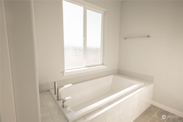 bathroom with a relaxing tiled tub