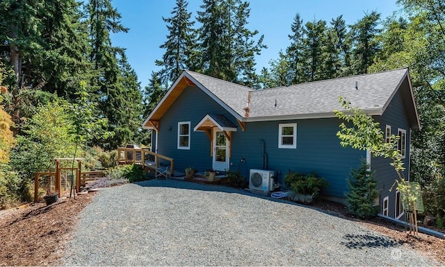 view of front of property featuring ac unit and a deck