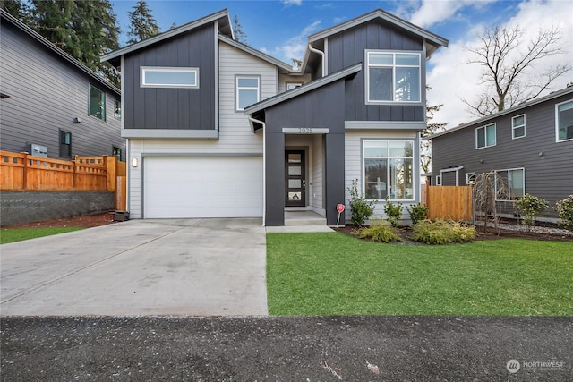 view of front of house with a garage and a front yard