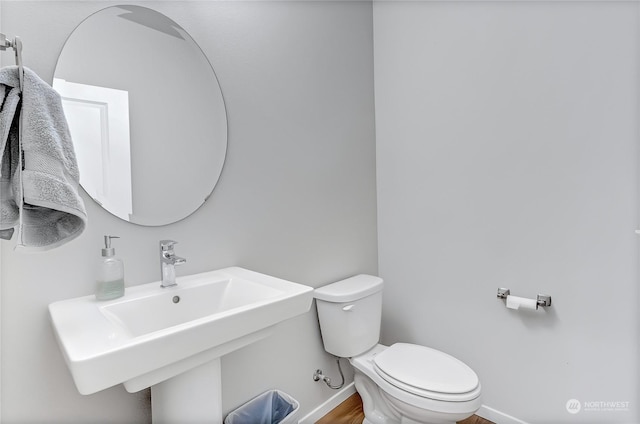 bathroom featuring sink and toilet