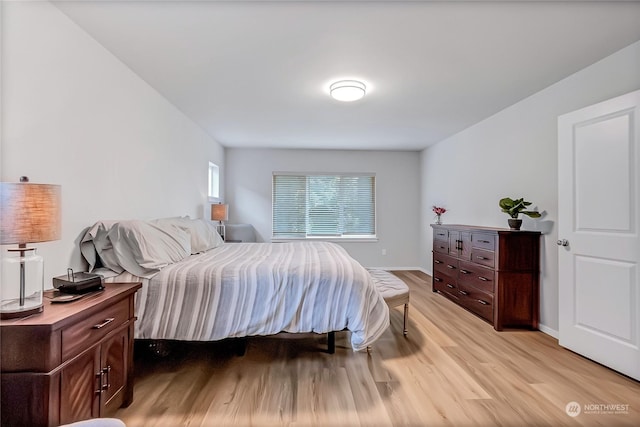 bedroom with light wood-type flooring