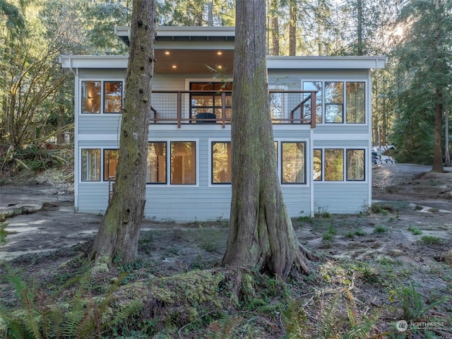 rear view of house with a balcony