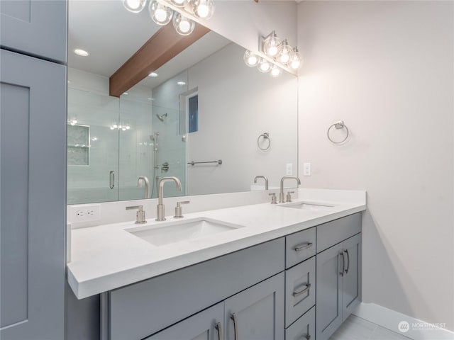 bathroom with vanity, a shower with shower door, beam ceiling, and tile patterned floors