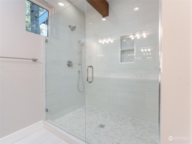 bathroom with tile patterned flooring, beamed ceiling, and an enclosed shower