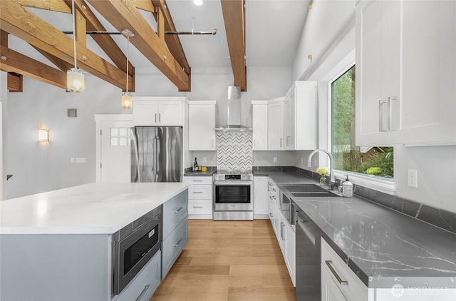 7339 Moon Valley Rd SE, North Bend, WA 98045 - kitchen featuring a wealth of natural light, decorative backsplash, stainless steel appliances, and wall chimney exhaust hood