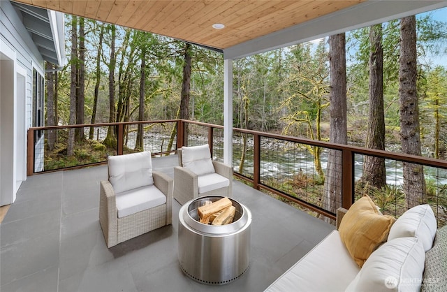 7339 Moon Valley Rd SE, North Bend, WA 98045 - sunroom with an outdoor living space, floor to ceiling windows, tile patterned floors, and wood ceiling