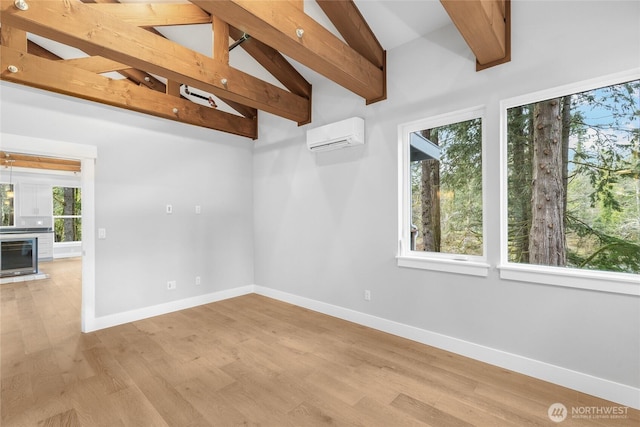 7339 Moon Valley Rd SE, North Bend, WA 98045 - unfurnished room with light wood-style flooring, plenty of natural light, baseboards, and a wall mounted AC