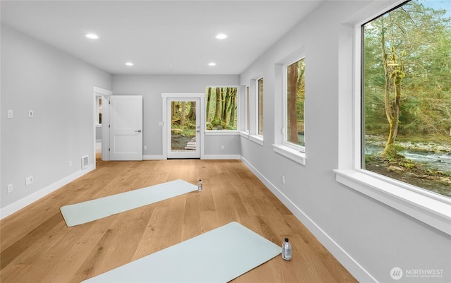 7339 Moon Valley Rd SE, North Bend, WA 98045 - workout area featuring recessed lighting, visible vents, baseboards, and wood finished floors