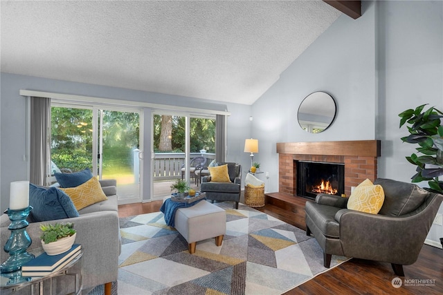 living room with wood-type flooring, a wealth of natural light, and lofted ceiling with beams