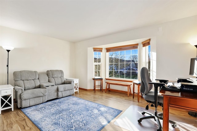 office area with light hardwood / wood-style flooring