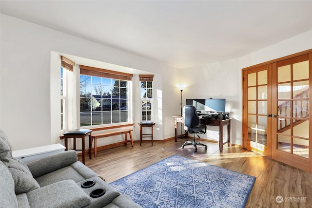 office area featuring hardwood / wood-style flooring and french doors