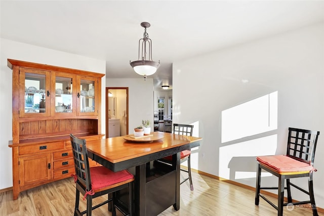 dining space featuring light hardwood / wood-style flooring