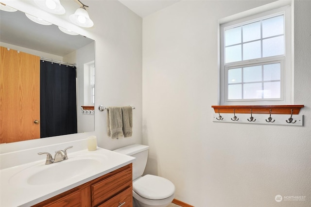 bathroom with vanity and toilet