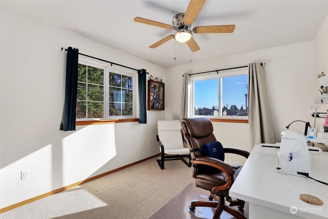 carpeted office with ceiling fan