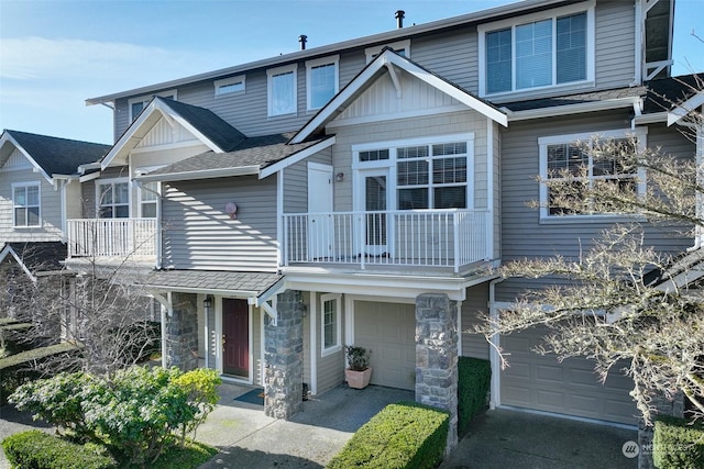 view of front of property with a balcony and a garage