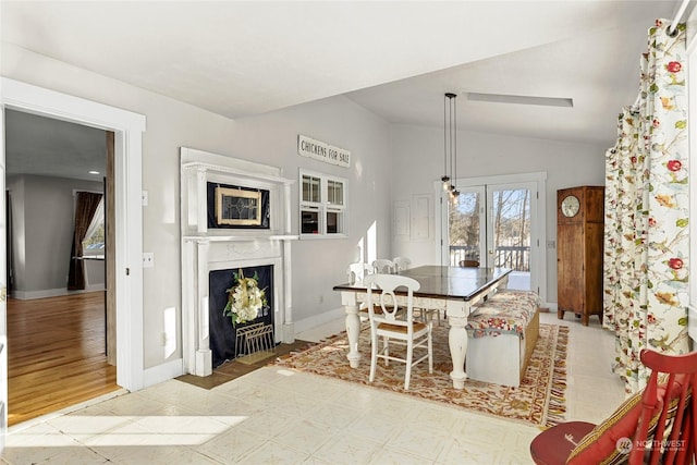 dining room with lofted ceiling