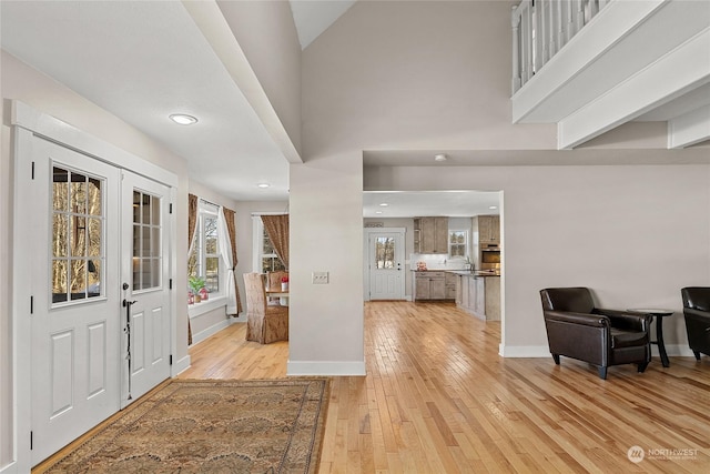 foyer with light hardwood / wood-style flooring