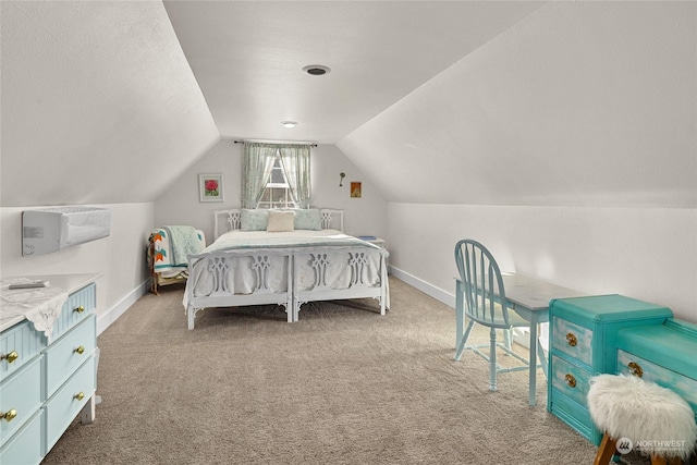 carpeted bedroom featuring vaulted ceiling