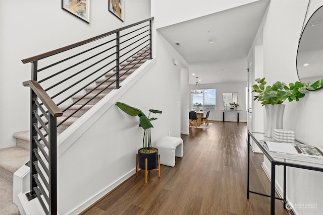 interior space with hardwood / wood-style floors and a chandelier