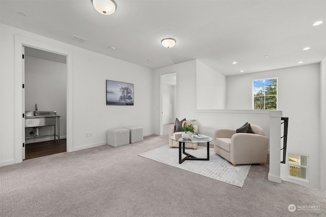 living room featuring light carpet