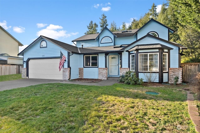 view of front of house with a garage and a front yard