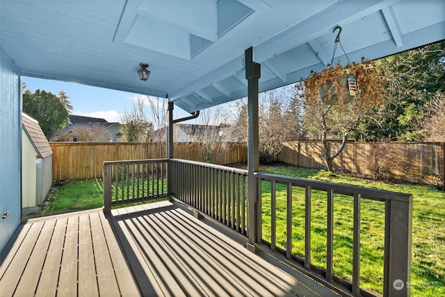 wooden terrace with a lawn