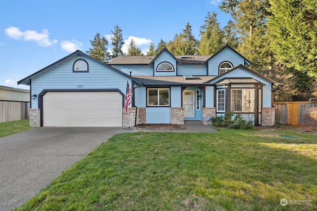 view of front of house featuring a garage and a front lawn