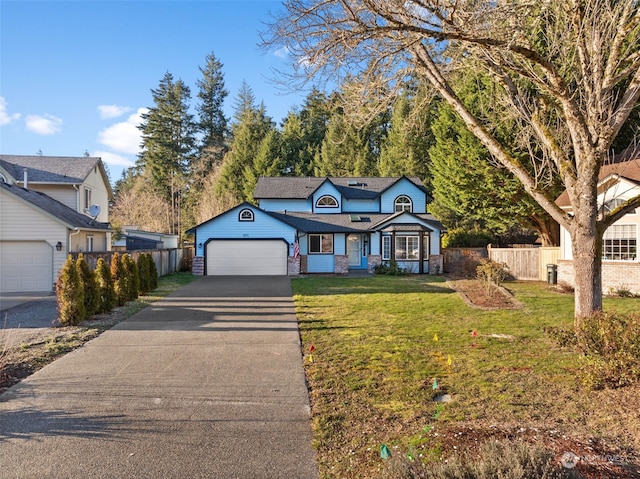 view of front of house with a garage and a front yard