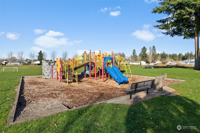 view of jungle gym with a lawn