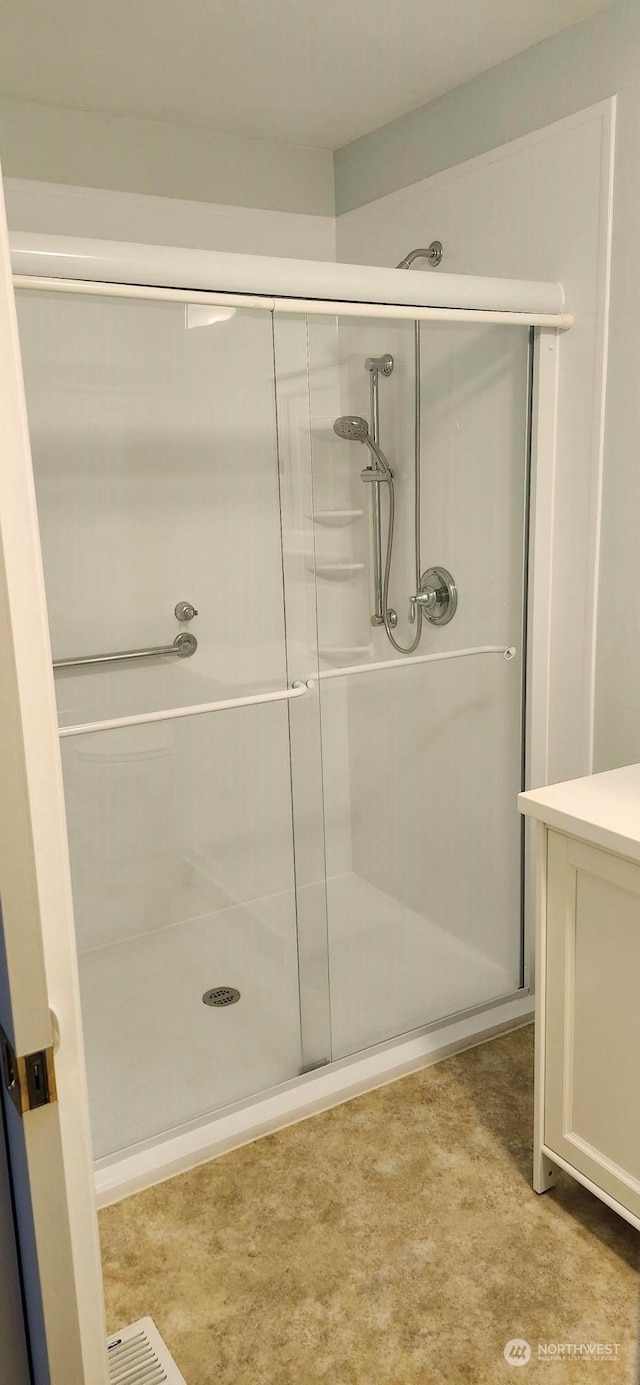 bathroom featuring an enclosed shower